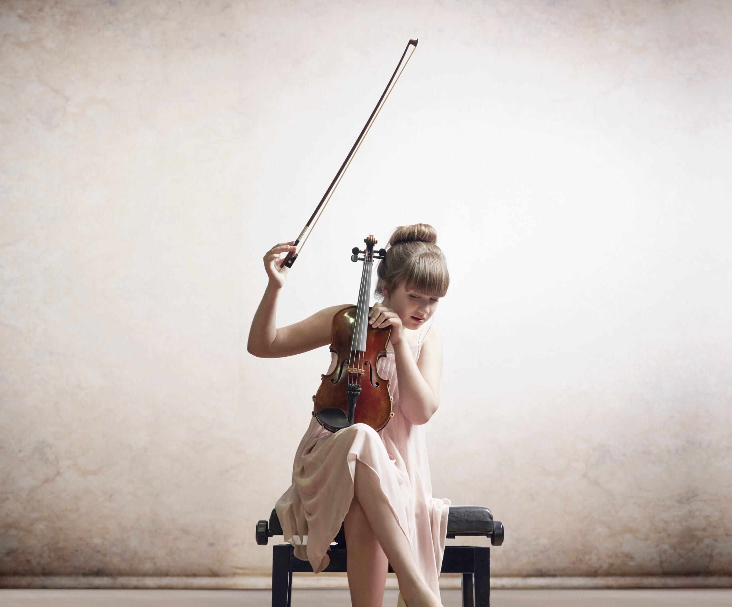 girl playing musical instrument