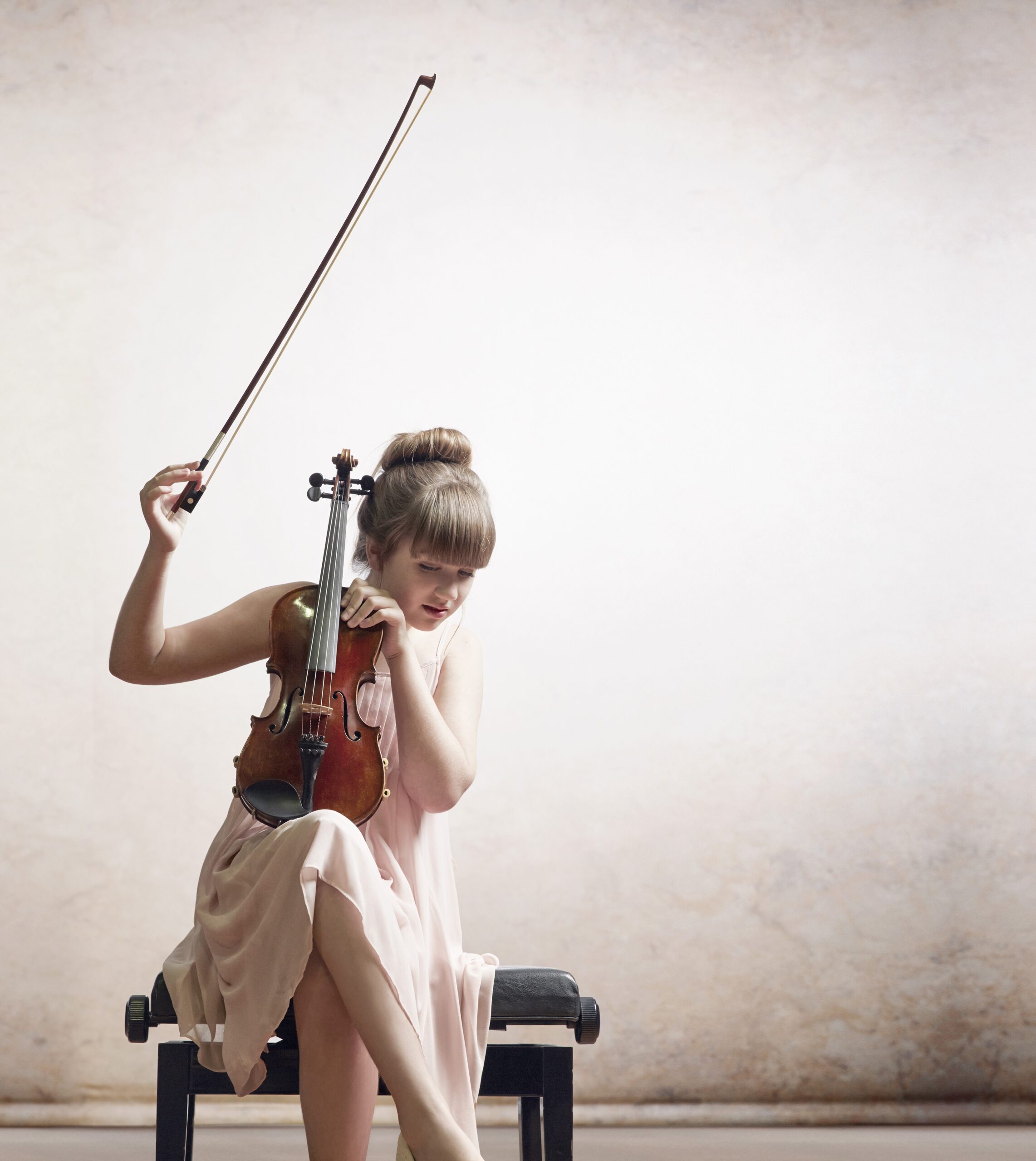girl playing musical instrument